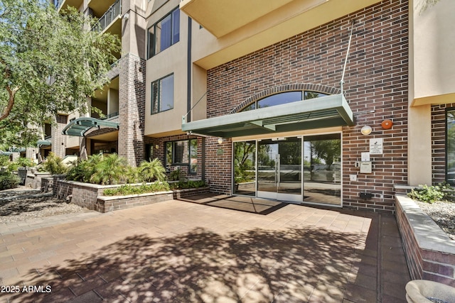 16 W Encanto Blvd Unit 22, Phoenix, AZ 85003 - doorway to property with brick siding and stucco siding