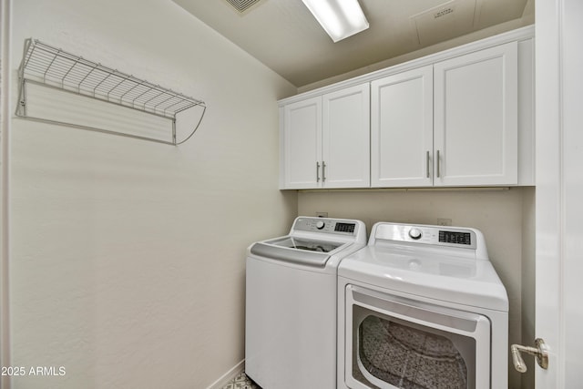 16 W Encanto Blvd Unit 22, Phoenix, AZ 85003 - washroom featuring separate washer and dryer, cabinet space, and baseboards