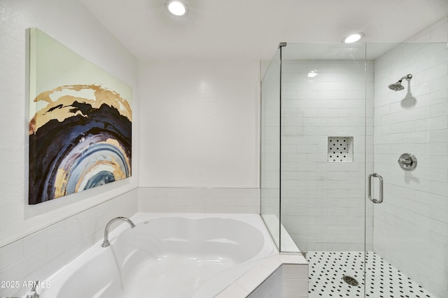 16 W Encanto Blvd Unit 22, Phoenix, AZ 85003 - bathroom featuring a stall shower, a garden tub, and recessed lighting