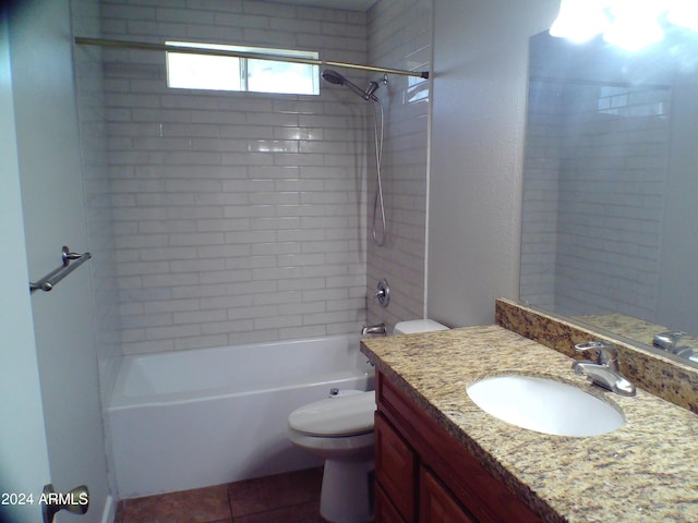 full bathroom featuring toilet, vanity, and tiled shower / bath