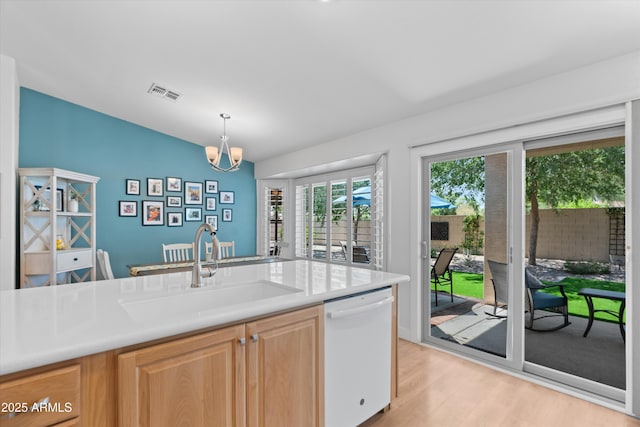 5024 S Citrus Ct, Gilbert, AZ 85298 - kitchen featuring white dishwasher, light wood-type flooring, light countertops, and a chandelier