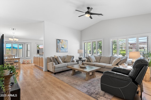 5024 S Citrus Ct, Gilbert, AZ 85298 - living room with a chandelier, healthy amount of natural light, light wood-style floors, a ceiling fan, and high vaulted ceiling