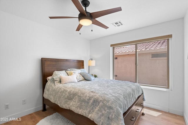 5024 S Citrus Ct, Gilbert, AZ 85298 - bedroom featuring light wood finished floors and a ceiling fan