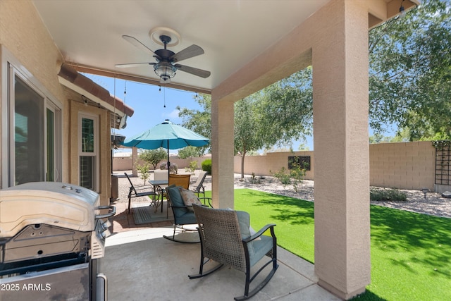5024 S Citrus Ct, Gilbert, AZ 85298 - fenced backyard featuring a grill, a ceiling fan, a patio, and outdoor dining space