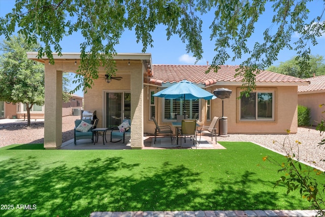 5024 S Citrus Ct, Gilbert, AZ 85298 - back of house with a patio area, a lawn, a tiled roof, and stucco siding