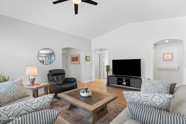 5024 S Citrus Ct, Gilbert, AZ 85298 - living area with arched walkways, lofted ceiling, light wood-style floors, and ceiling fan