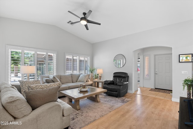 5024 S Citrus Ct, Gilbert, AZ 85298 - living area with arched walkways, a ceiling fan, lofted ceiling, and light wood-type flooring