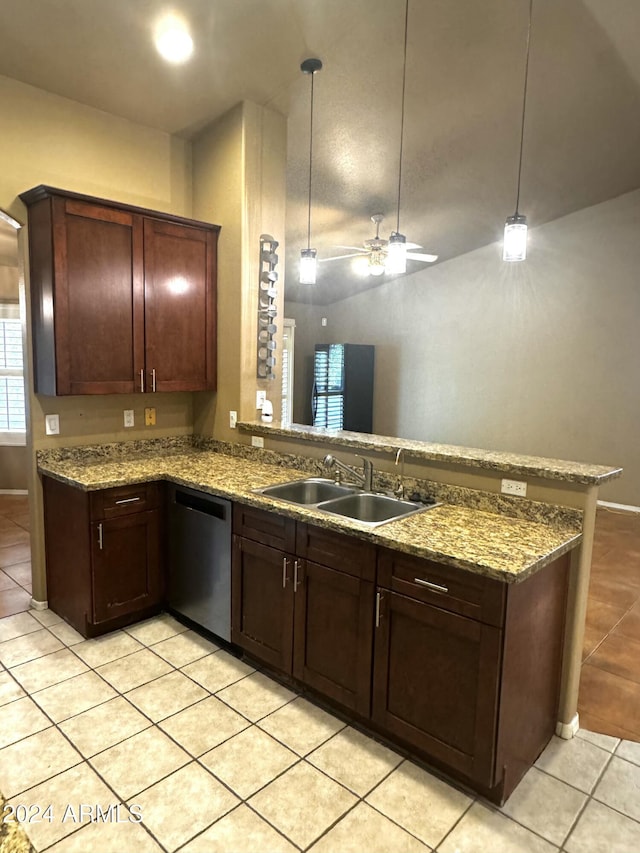 kitchen featuring pendant lighting, sink, light tile patterned flooring, and stainless steel dishwasher