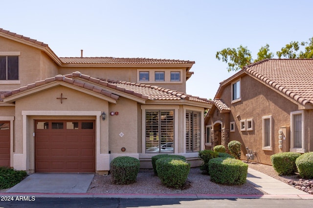 mediterranean / spanish-style house featuring a garage