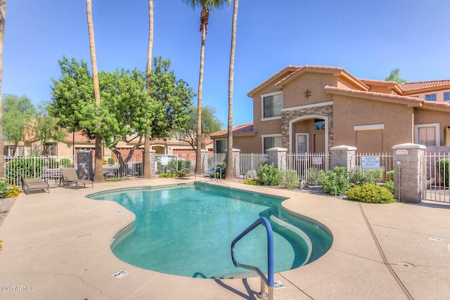 view of swimming pool with a patio area