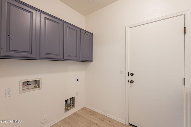 washroom with cabinets, electric dryer hookup, hookup for a gas dryer, hookup for a washing machine, and light hardwood / wood-style floors