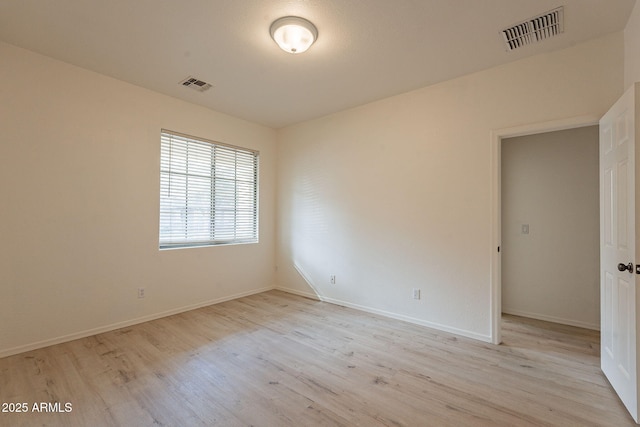 unfurnished room featuring light hardwood / wood-style floors