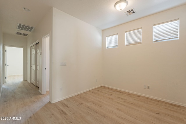 unfurnished room featuring light wood-type flooring