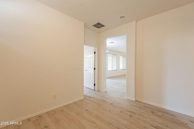 spare room with light hardwood / wood-style flooring