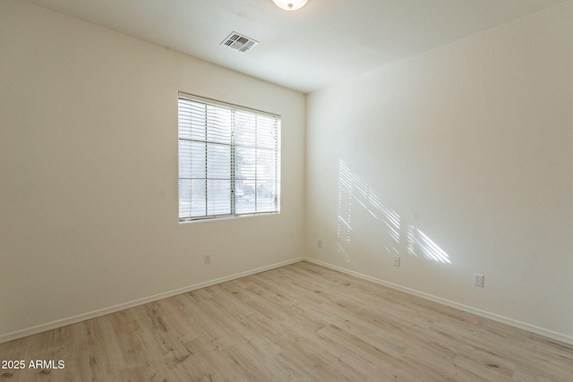 unfurnished room featuring light hardwood / wood-style floors