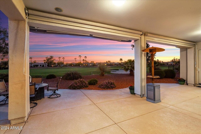 view of patio terrace at dusk