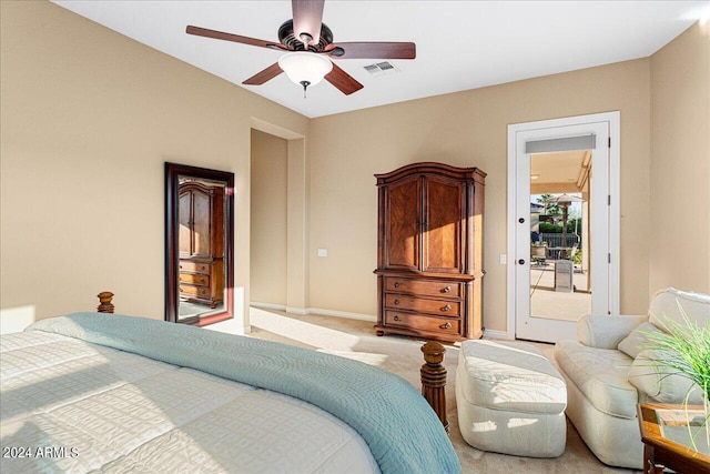 carpeted bedroom featuring ceiling fan and access to exterior