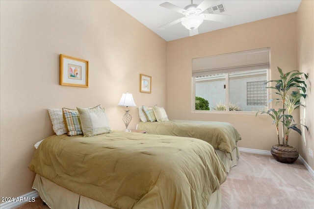 bedroom with light colored carpet, ceiling fan, and vaulted ceiling