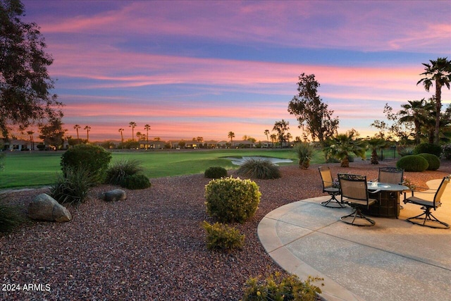 patio terrace at dusk with a lawn