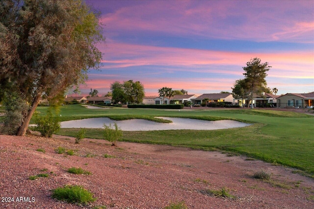 surrounding community featuring a lawn