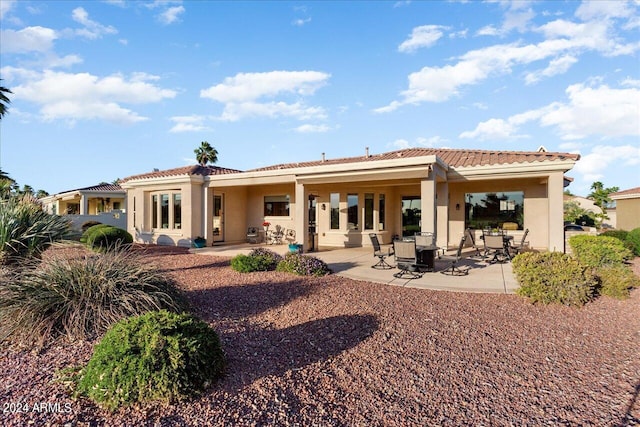 rear view of house featuring a patio area