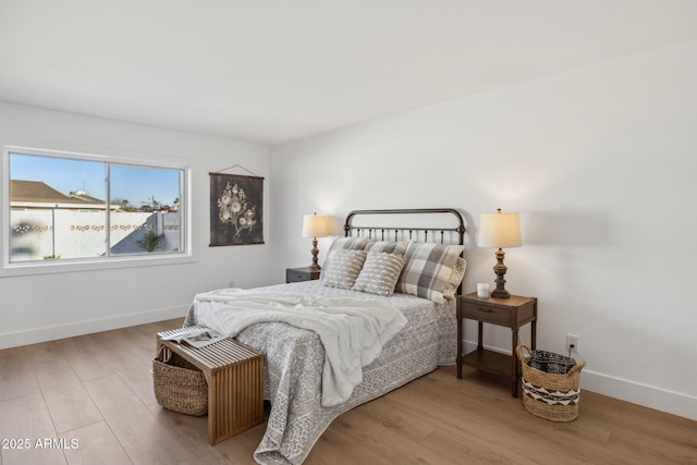 bedroom with hardwood / wood-style floors