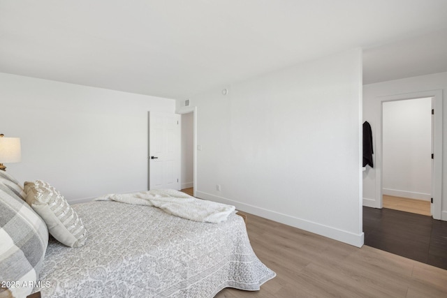 bedroom featuring wood-type flooring