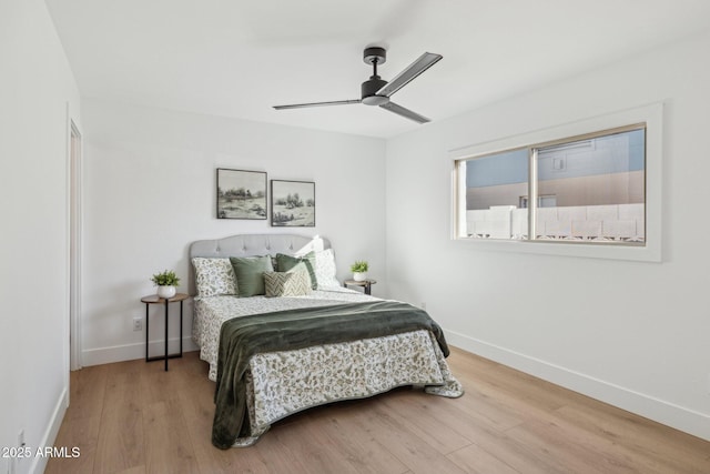 bedroom with hardwood / wood-style flooring and ceiling fan