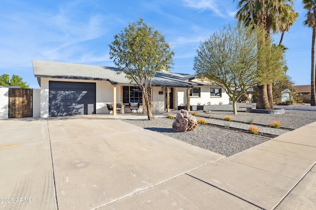 ranch-style home featuring a garage