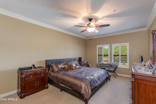 carpeted bedroom with crown molding and ceiling fan