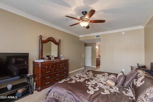 bedroom with ceiling fan, connected bathroom, light colored carpet, and crown molding