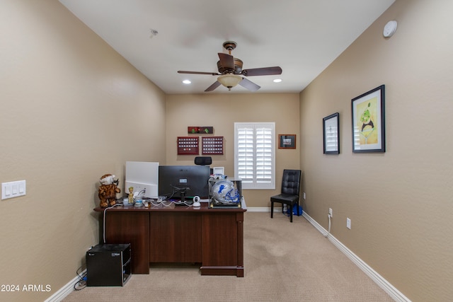 carpeted home office with ceiling fan