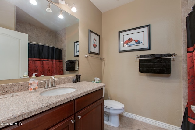 bathroom featuring walk in shower, vanity, toilet, and tile patterned floors