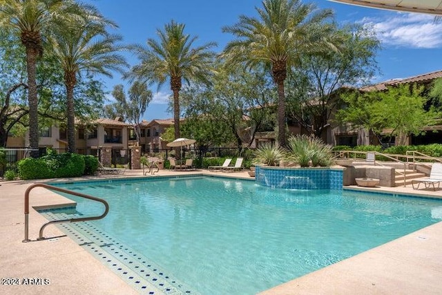 view of swimming pool with a patio area