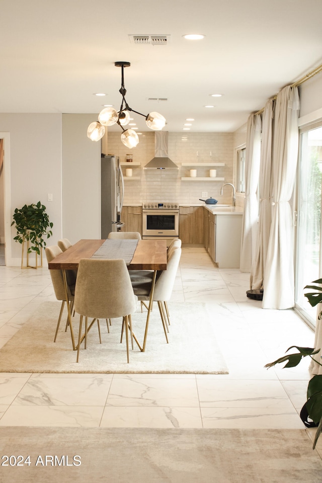 dining space featuring sink