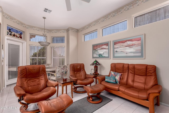 12803 W Amigo Dr, Sun City West, AZ 85375 - living area featuring light tile patterned flooring and ceiling fan