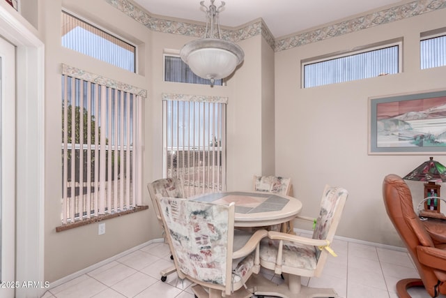 12803 W Amigo Dr, Sun City West, AZ 85375 - dining area featuring plenty of natural light, tile patterned flooring, and a towering ceiling