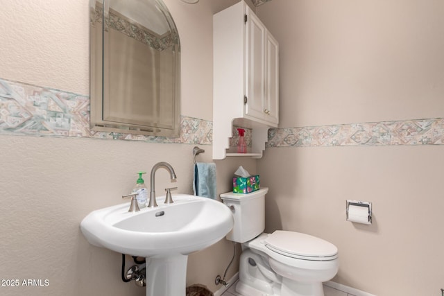 12803 W Amigo Dr, Sun City West, AZ 85375 - bathroom featuring toilet and a sink