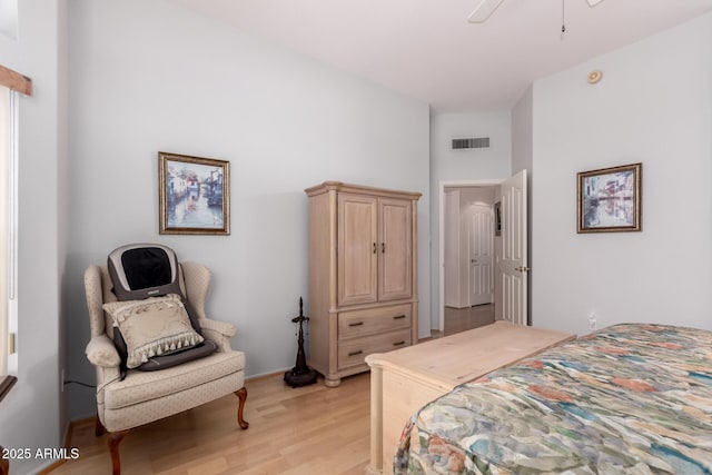 12803 W Amigo Dr, Sun City West, AZ 85375 - bedroom featuring light wood finished floors and a towering ceiling