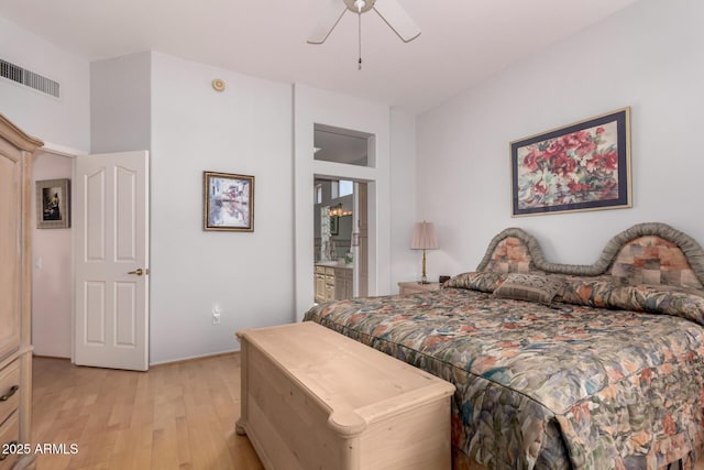 12803 W Amigo Dr, Sun City West, AZ 85375 - bedroom with light wood-style floors, ensuite bathroom, and a ceiling fan