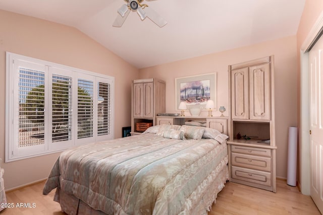 12803 W Amigo Dr, Sun City West, AZ 85375 - bedroom with light wood-style flooring, vaulted ceiling, and a ceiling fan