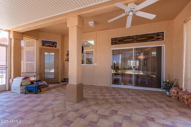 12803 W Amigo Dr, Sun City West, AZ 85375 - doorway to property featuring a ceiling fan, a patio, and stucco siding