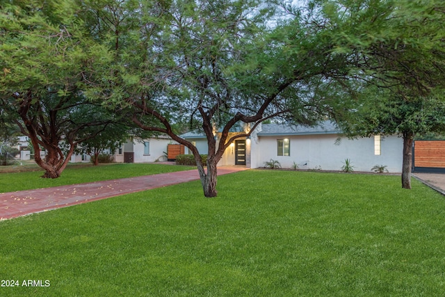 view of front of property with a front lawn