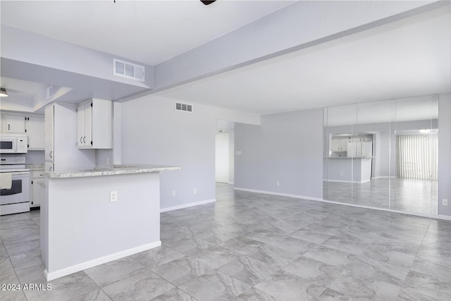 kitchen featuring white cabinetry and white appliances