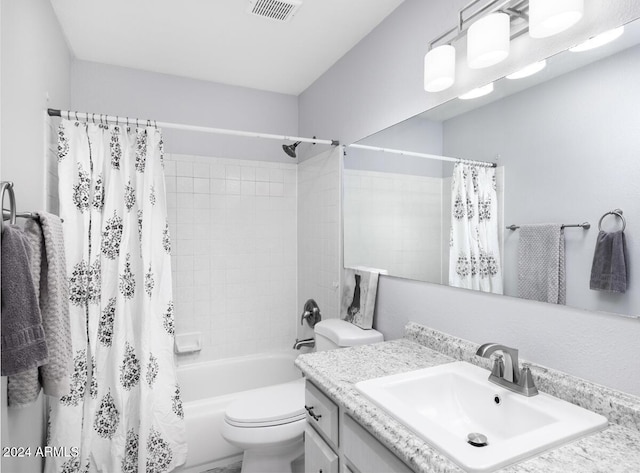 full bathroom with vanity, toilet, and shower / tub combo with curtain