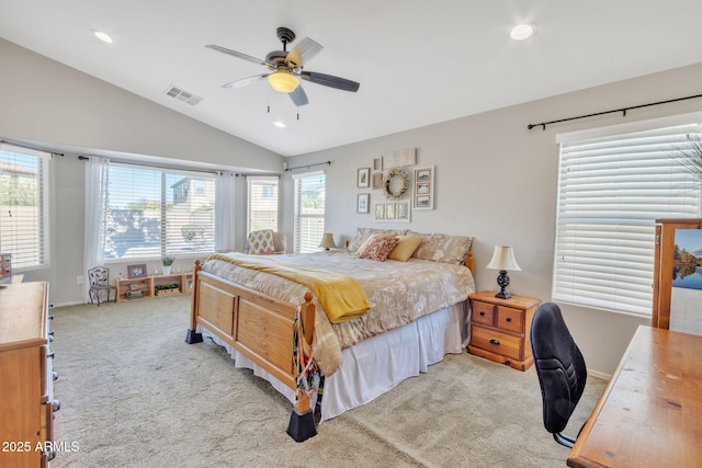 carpeted bedroom featuring vaulted ceiling and ceiling fan