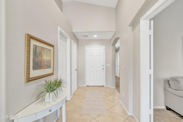 corridor with light tile patterned flooring