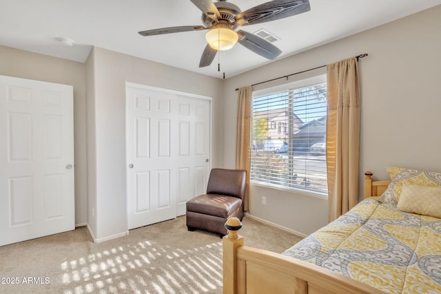 bedroom featuring carpet floors, a closet, and ceiling fan