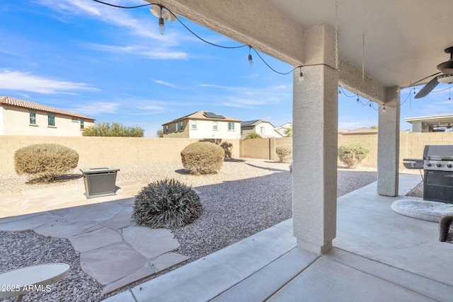 view of patio featuring ceiling fan