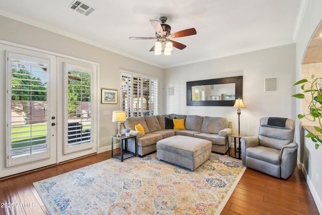 living room with visible vents, ornamental molding, french doors, wood-type flooring, and baseboards